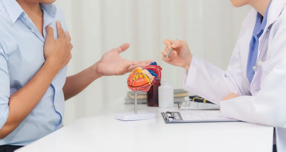 Singapore Cardiologist consulting patient